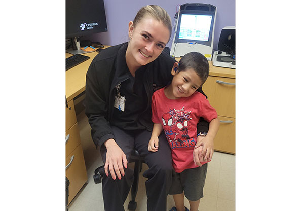 Tristan with CHRISTUS Children's care team